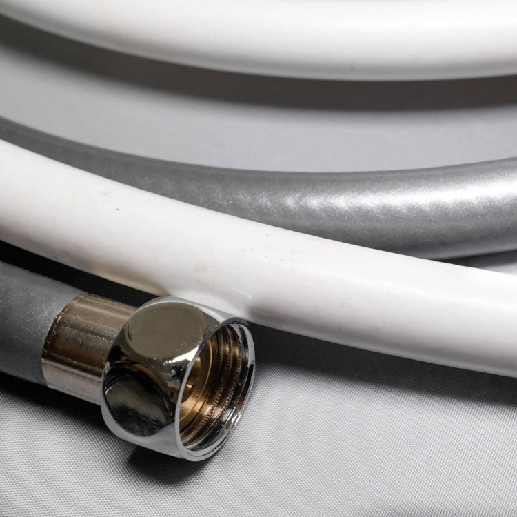 close up image of silver and white shower hose