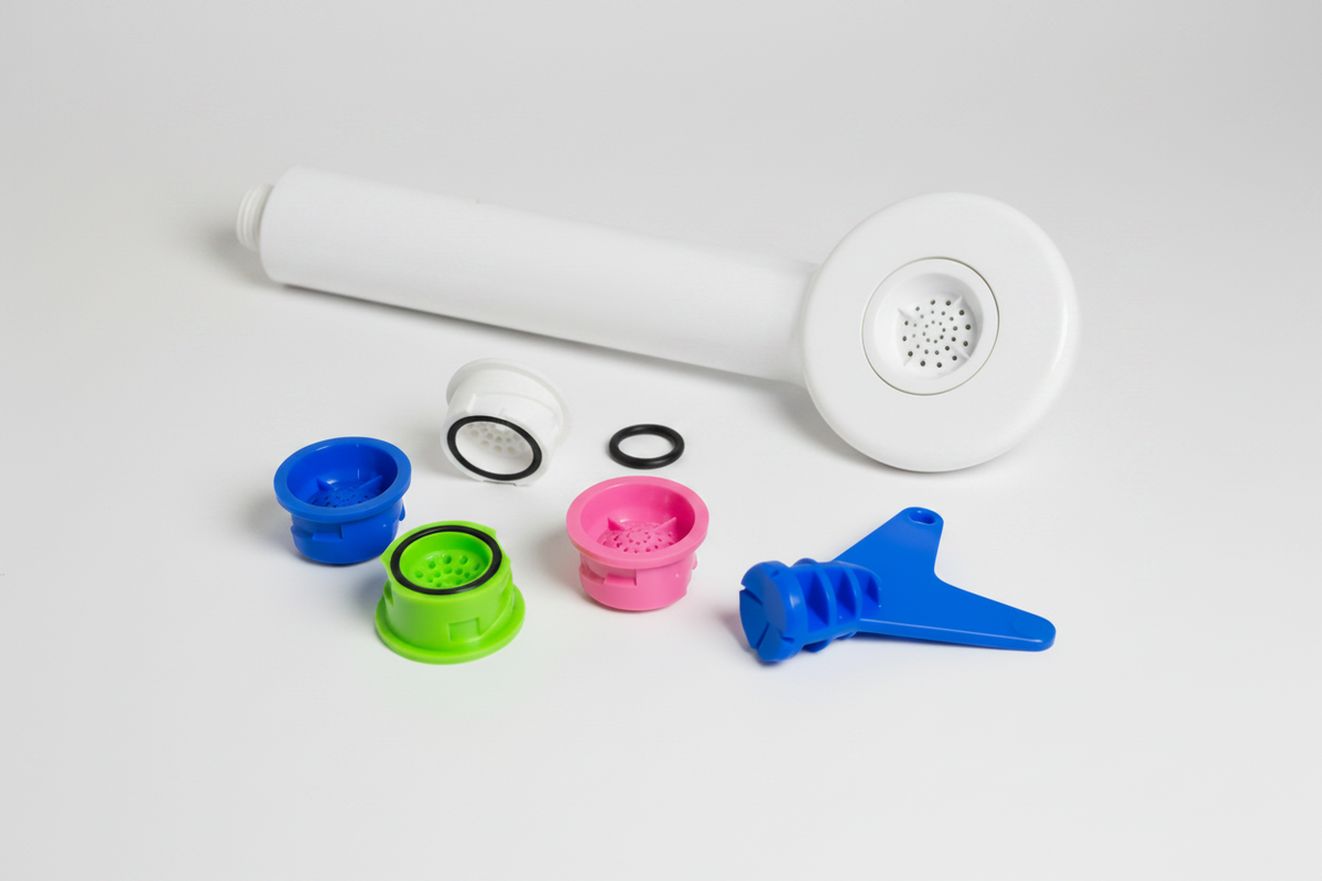 White handheld shower head with multiple colorful nozzles 